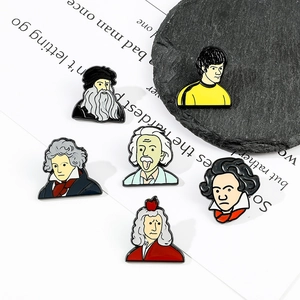 Macro shot of colorful enamel metal lapel pins featuring Einstein and Newton icons