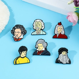 Detailed close-up of colorful cartoon enamel pins featuring famous historical figures