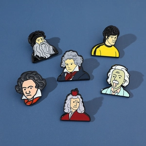 Set of six colorful enamel pins featuring cartoon portraits of famous historic icons