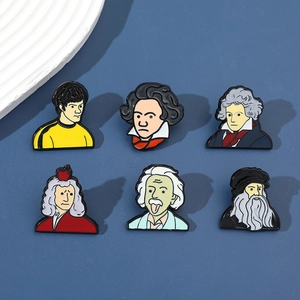 Detail view of six cartoon enamel pins featuring famous icons like Einstein and Newton