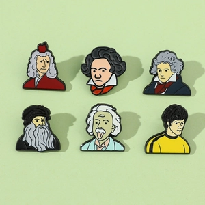 Set of creative cartoon enamel pins featuring Einstein and Newton on green background