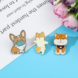 Detailed view of three cute cartoon dog enamel pins on a decorative background