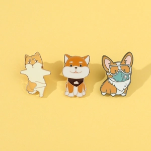 Detailed set of cartoon Shiba Inu and Corgi enamel pins with polished gold metal edges