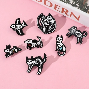 Detailed set of black enamel animal skeleton pins including cat dog and bird designs