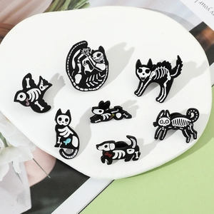 Group of gothic animal skeleton enamel pins featuring cat, dog, and bird motifs