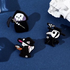 Macro detail of Halloween enamel pins featuring grim reaper, plague doctor and magic cat