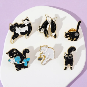 Set of six cute cartoon cat enamel pins featuring playful poses and fish on a lilac background