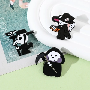 Detailed close-up of gothic Halloween enamel pins featuring reaper and magic cat