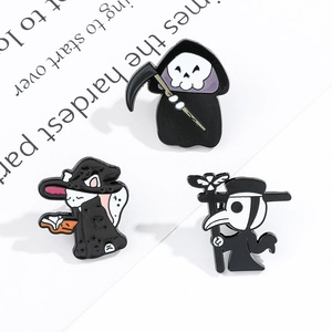 Detailed view of Halloween enamel pins featuring Grim Reaper, Raven Mask, and Magic Cat