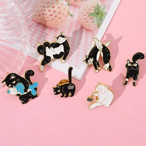 Set of six creative cartoon cat enamel pins featuring kittens holding fish and wings