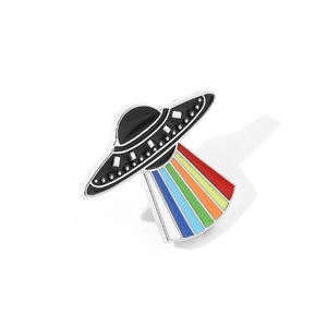 Detailed view of UFO enamel pin with vibrant rainbow light beam and silver metallic edges