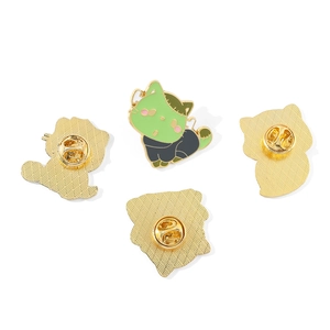 Macro detail of Halloween ghost cat enamel pins with secure butterfly clasp backings