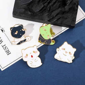 Set of four spooky Halloween enamel cat pins including mummy and ghost designs