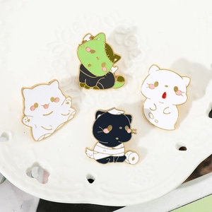 Funny Halloween cat enamel pins set featuring ghost and mummy themes on a ceramic tray