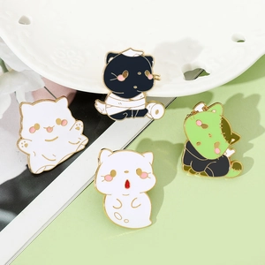 Detailed view of four spooky Halloween cartoon cat enamel pins in ghost and mummy styles
