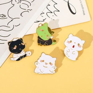 Detailed view of four Halloween cat enamel pins featuring mummy and ghost cat designs
