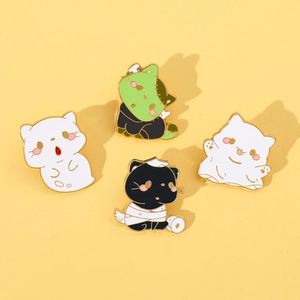 Detailed view of four cute Halloween cat enamel pins including ghost and mummy styles