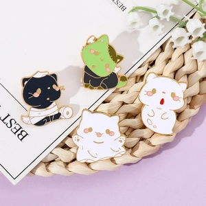Set of four cute Halloween enamel pins featuring ghost cat and mummy cat designs
