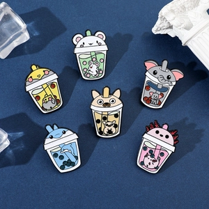 Close-up of cute cartoon animal milk tea enamel pins with various animal head designs