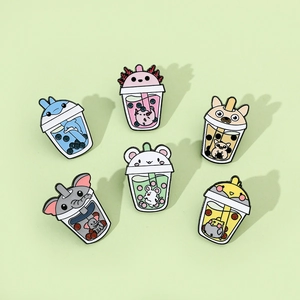 Detailed view of six cartoon animal bubble tea enamel pins on light green background