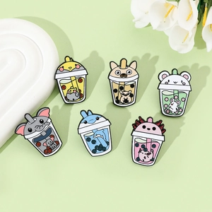 Detailed view of six enamel pins featuring cartoon animals in bubble tea cups