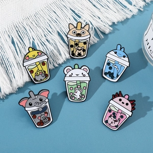 Detail of six enamel pins featuring cute animals in bubble tea cups with boba pearls