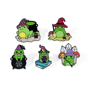 Detailed view of 5 cute frog enamel pins with magical wizard hats and crystal balls