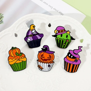 Detailed close-up of colorful Halloween cupcake enamel pins with pumpkin and skull motifs