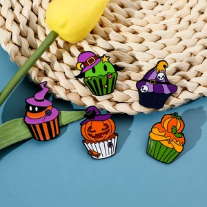Detailed set of 5 Halloween cupcake enamel pins with pumpkins and skulls on a blue background