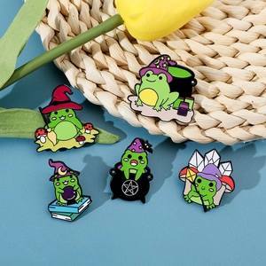 Detailed set of five cartoon magic frog enamel pins with wizard hats and potion cauldrons