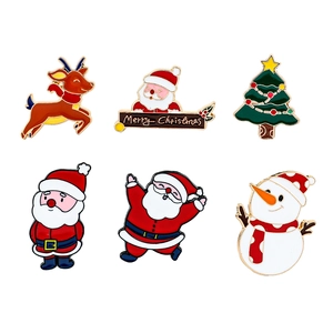 Set of six colorful Christmas enamel pins featuring Santa Claus, reindeer, and snowman
