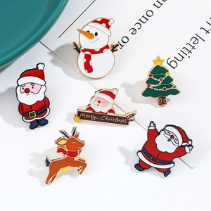 Set of six Christmas enamel pins featuring Santa, reindeer, and snowman designs