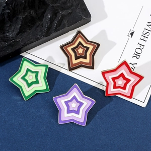Detailed view of 4-pack colorful star enamel pins with glazed finish and metal edges