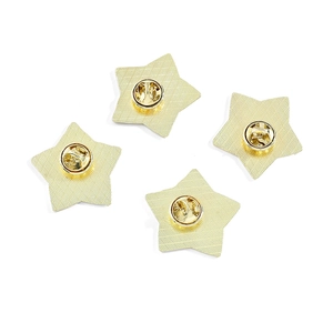 Pack of four gold star metal brooches featuring textured backs and butterfly clutch backs