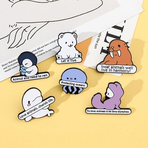 Detailed view of six enamel pins featuring cartoon marine animals and eco-friendly slogans