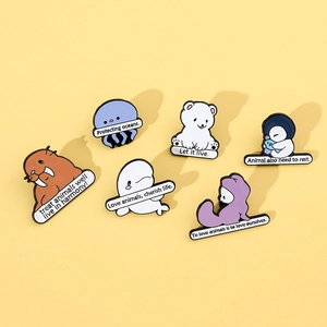 Detail view of a 6-piece ocean animal enamel pin set featuring marine conservation slogans