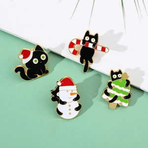 Detailed set of four Christmas black cat enamel pins featuring holiday themes and gold plating