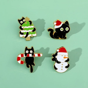 Detailed set of four Christmas black cat enamel pins with festive holiday motifs