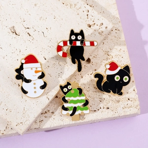 Set of four Christmas cat enamel pins featuring black cats with snowmen and candy canes