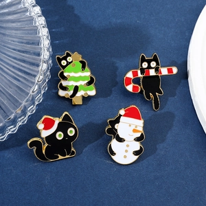 Detailed set of four cartoon black cat Christmas enamel pins with holiday festive motifs