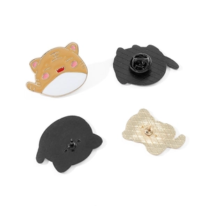 Detailed macro view of cute cartoon cat enamel pins showing front design and back pin clasp