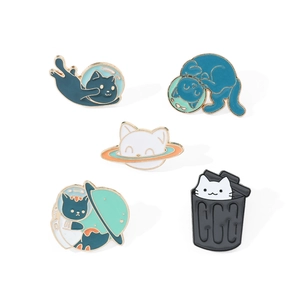 Set of five cute cartoon cat enamel pins in creative space and quirky poses on white background