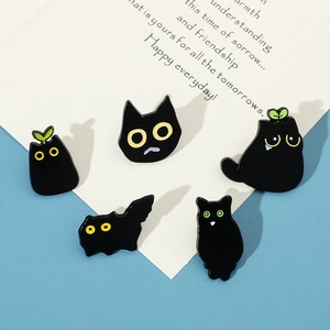 Set of five cute black cat enamel pins featuring various expressions and green sprouts