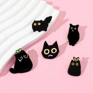 Set of 5 black enamel cartoon cat pins with cute expressions on white stand