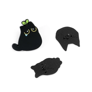 Cute black cat enamel pin with a green sprout on head and yellow eyes with blue tears