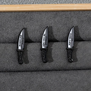 Three enamel dagger pins in a display box featuring Don't touch me and social slogans