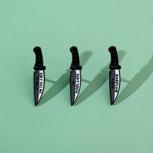 Three-piece set of black and white dagger enamel pins with feminist quote slogans