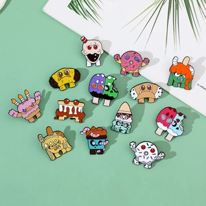 Detail shot of cute cartoon enamel pins with donut and ice cream monster shapes