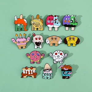 Detailed close-up of colorful cartoon monster dessert enamel pins set on a mint background