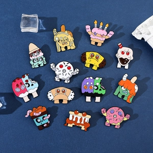 Detailed collection of 12 colorful dessert monster enamel pins on a dark blue background
